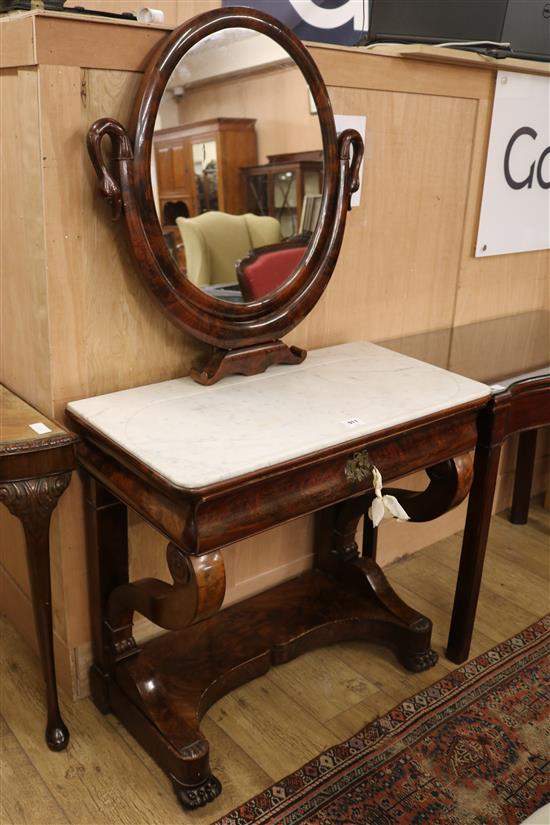 An Empire flame mahogany marble topped dressing table W.81cm